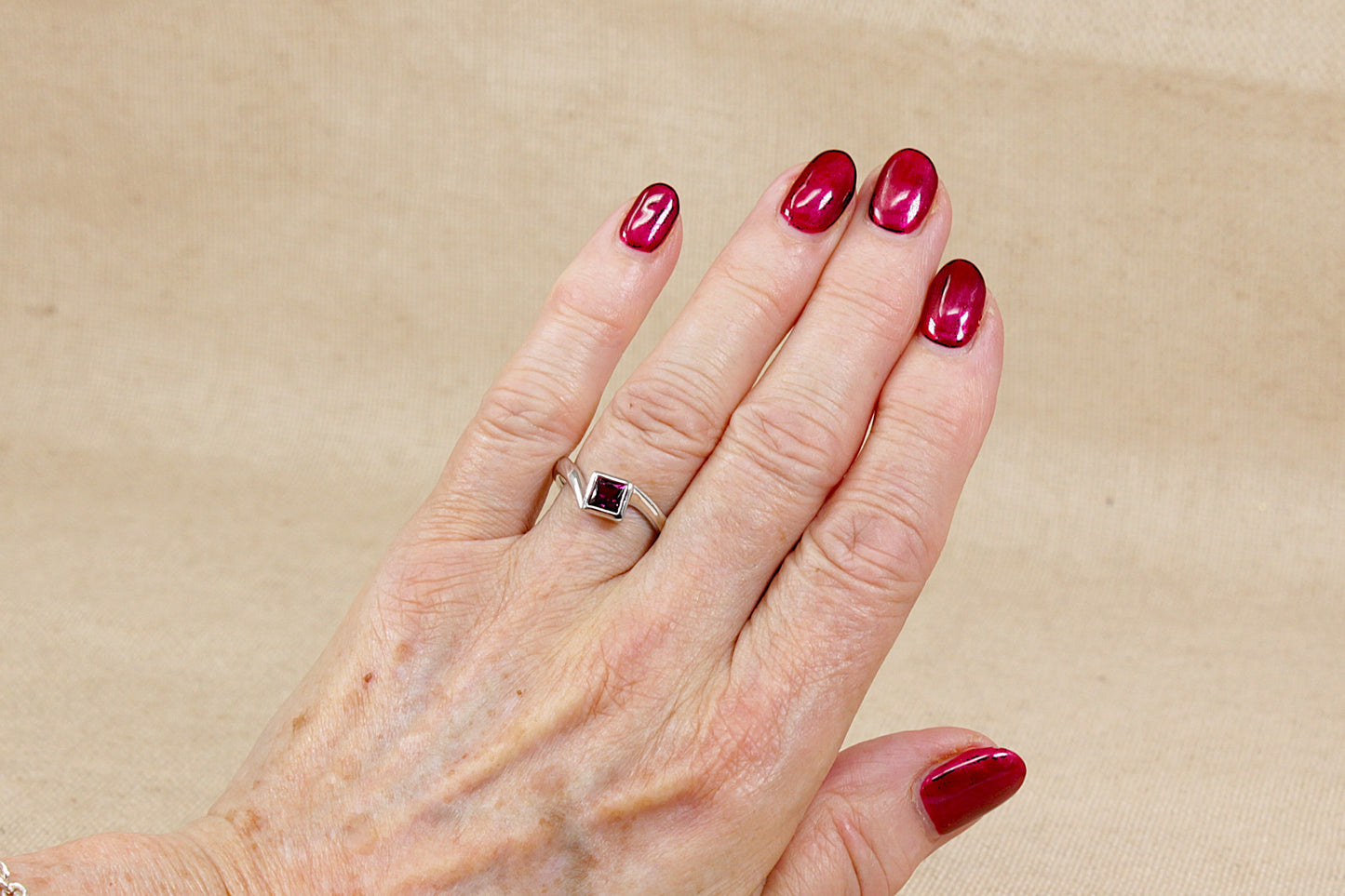 Elegant Sterling Silver Rhodolite Garnet Twist Ring