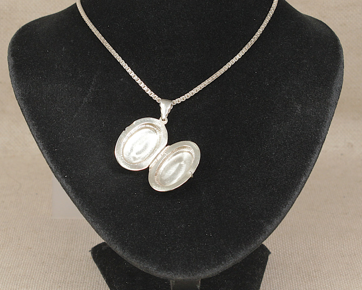 Elegant Sterling Silver Oval Opening Locket Necklace