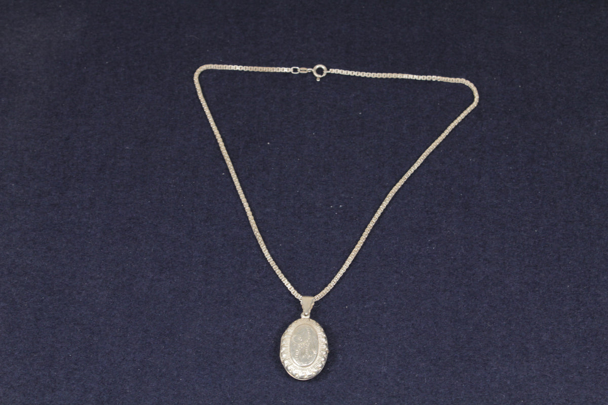 Elegant Sterling Silver Oval Opening Locket Necklace