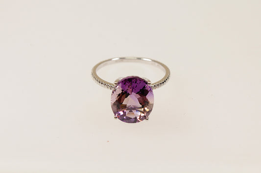 This stunning 9ct Gold solitaire features a captivating oval-shaped Amethyst gemstone; known for its sparkle and vibrant purple colour, UK finger size O.