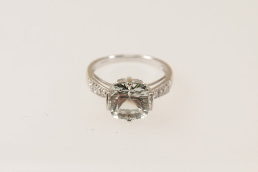 A 9ct White Gold large cushion cut pale green Citrine, Each shoulder has 3 Diamond accents, enhancing the ring’s brilliance, inside the band it has Birmingham hallmarks for 2008, UK Finger size: O.