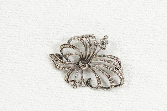 Vintage Silver marcasite brooch with floral design on a white background