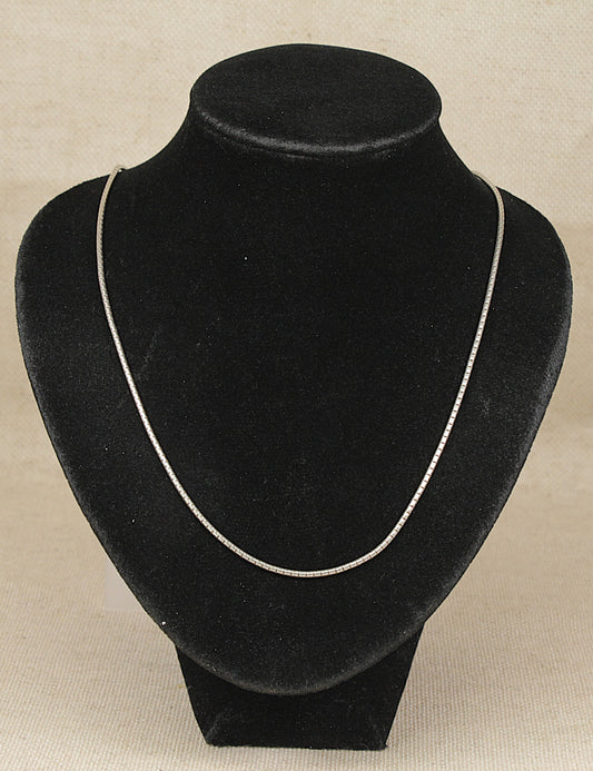 Authentic Pandora Sterling Silver Snake Chain Necklace on a black necklace bust on a beige background