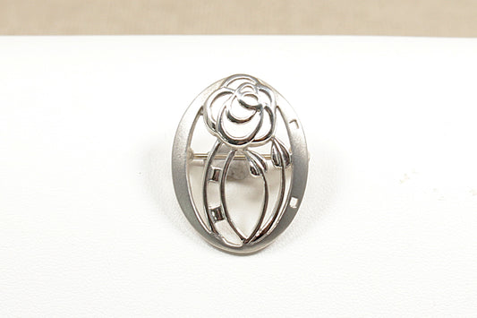 A beautiful handcrafted Silver brooch by the renowned designer Kit Heath the design are often inspired by nature and classic movements like Art Nouveau  It is in excellent condition and stamped KH and 925 for sterling silver.